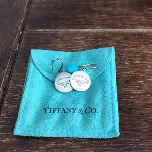 Return to Tiffany & Co round tag earrings. 2000’s